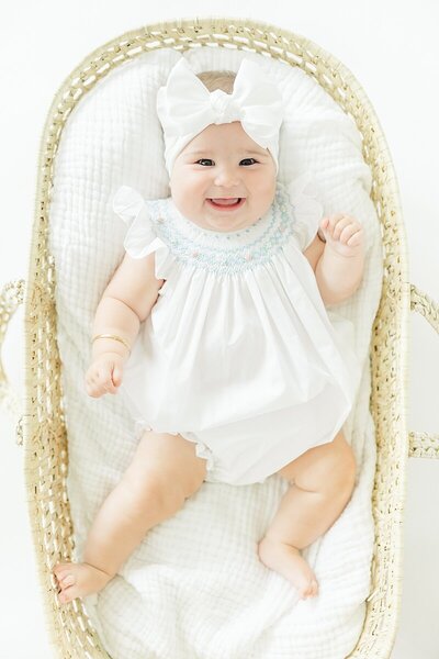 3 month baby girl in basket for studio milestone photos