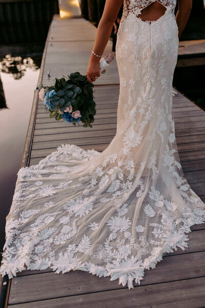 A long, beautiful wedding dress train showcasing the brides elegant dress. 