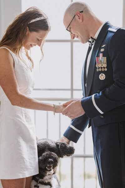 bride and groom with the dog first look before ceremony
