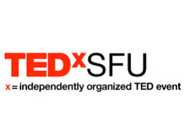 The logo forTEDxSFU, an independently organized TED event. The logo consists of the text "TEDxSFU" where "TED" is in bold red letters, followed by "xSFU" in black. Below the logo, there is a smaller line of text in black that reads "x = independently organized TED event."