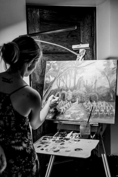 Steph painting at a wedding