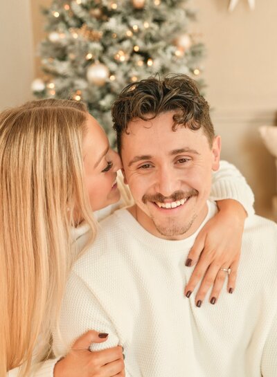 Styled Christmas photo setup at Evermore Place in Gray, Maine featuring a flocked tree and cozy seating