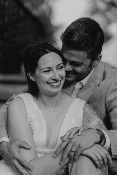 couple holding hands in their home