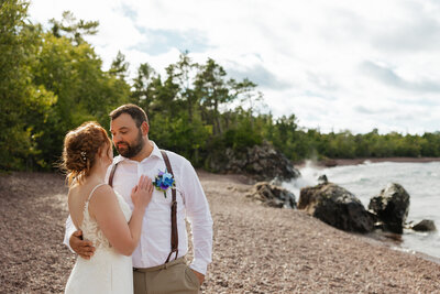 bride and groom walking in a cascading waterfall