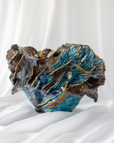 Gerda Satunas' handcrafted ceramic sculpture with intricate patterns.