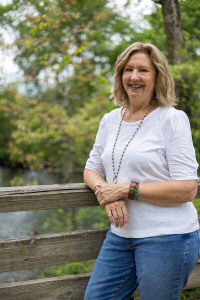 Woman leaning on bridge