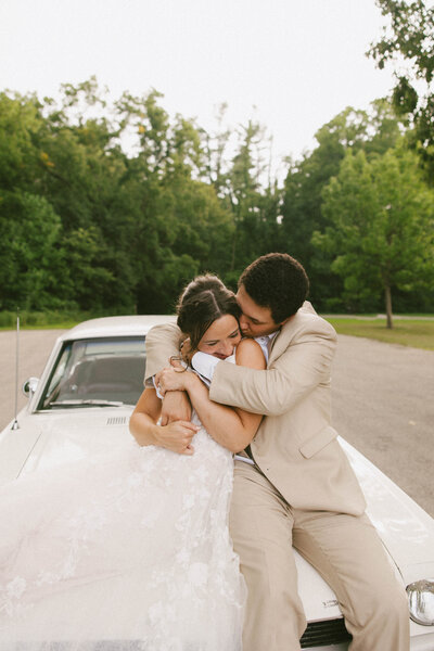 couple running down road during engagement photos