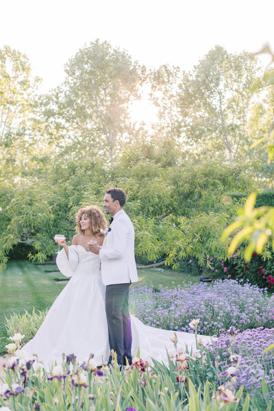 happy-bride-groom-toast-outdoor-wedding-spring-flowers-sunkissed-moment