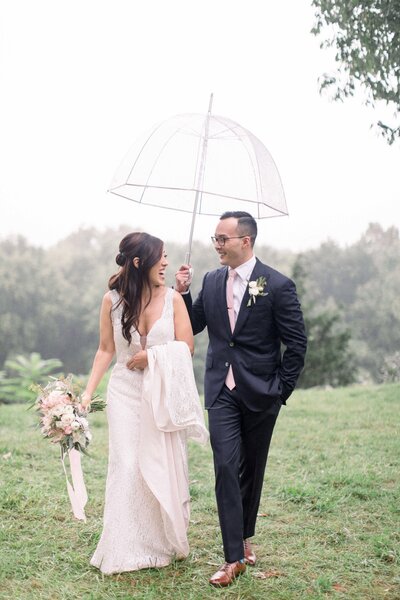 Bride & Groom at their rainy wedding day in canton ohio planned by sirpilla soirees