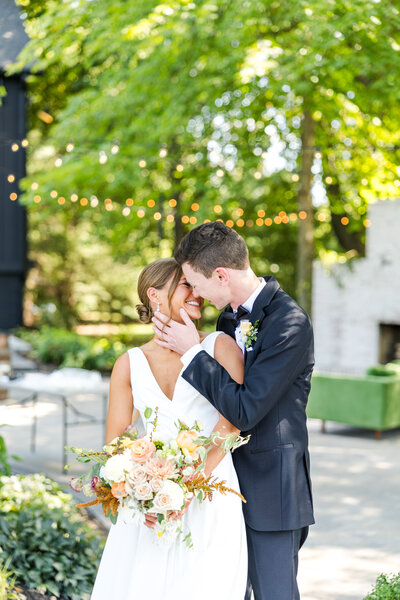 bride and groom embrace  each other