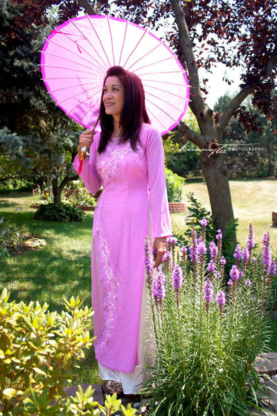 Beautiful Woman in Vietnamese Dress Holding Wagasa