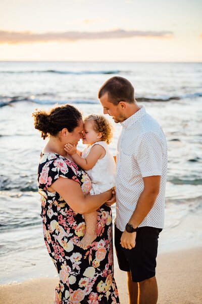 Dad kisses baby during Big Island Family Photography
