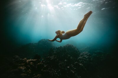 woman swimming underwater