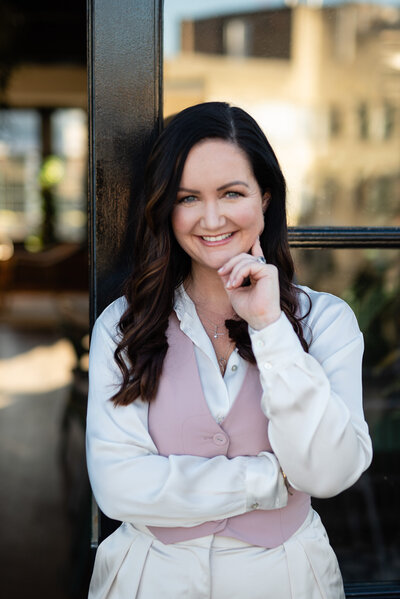 Bryony Williams in pink vest and white shirt