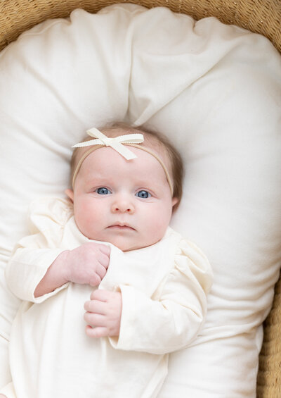 Photo of a newborn baby in bassinet