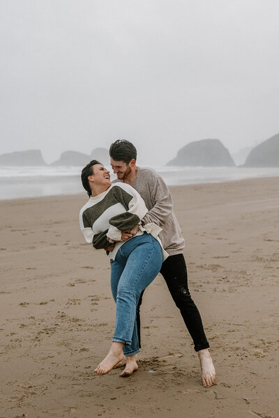 These two adventured along Cannon Beach with Haystack Rock as their backdrop, running barefoot through the sand, chasing the tide, and soaking in a golden coastal sunset.