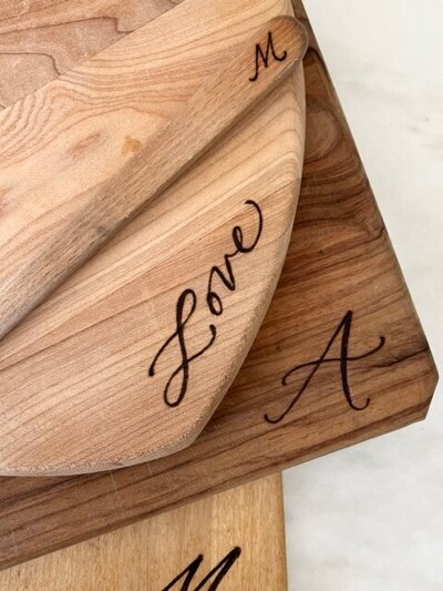 Cutting boards with custom wood burned calligraphy