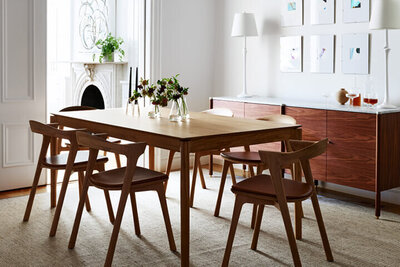 Classic brownstone interior design showcasing modern dining room furniture by Boston interior decorators, blending heritage with modern flair.
