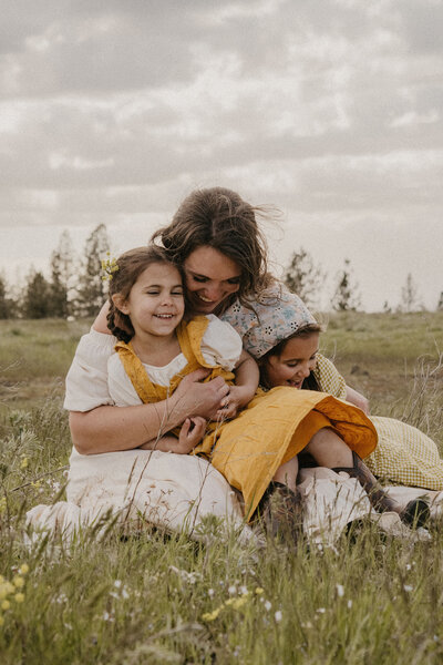 Documentary family photographer in Spokane capturing relaxed, real-life moments during at-home session.