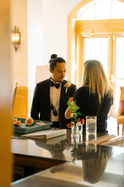A colorado wedding planner laughing with her clients