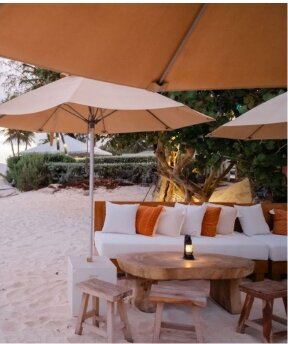 luxury resort umbrella and couch setup