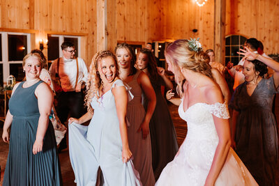 bride dancing with wedding guests