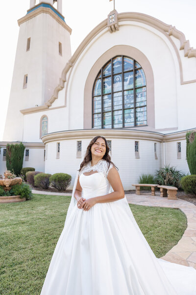 Bride in front of a catholic church, captured by a Virginia wedding photographer