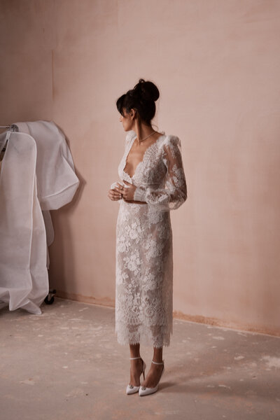 Bride wearing soft french lace pencil skirt & blouse by British bridal designer Luna Bea