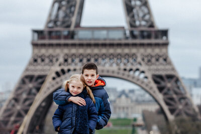 Brother and sister in front of Eiffel tower