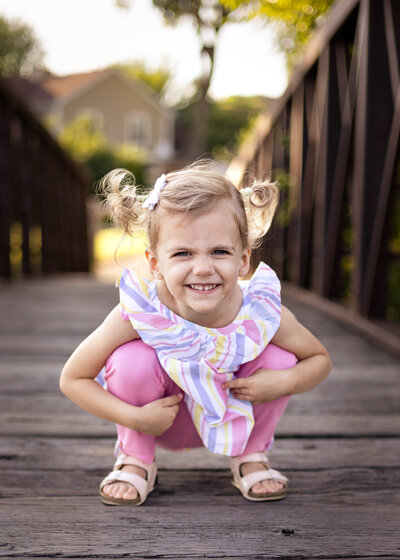 Picture of little girl crouching down