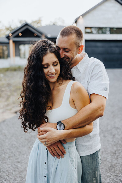 Couple hugging for engagement photos