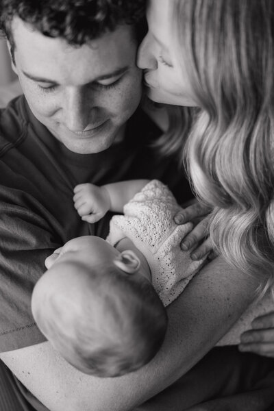 Indianapolis lifestyle family photography parents with newborn