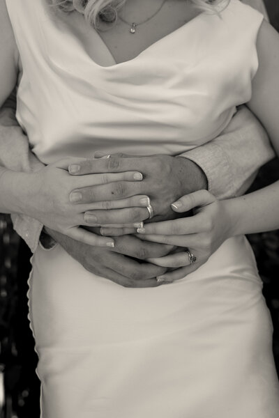Bride& Groom Kissing underneath a sun light veil at Arizona Wedding.