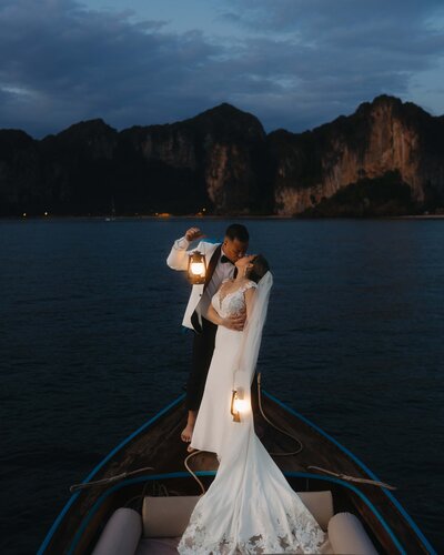 bride and groom running in sand dunes