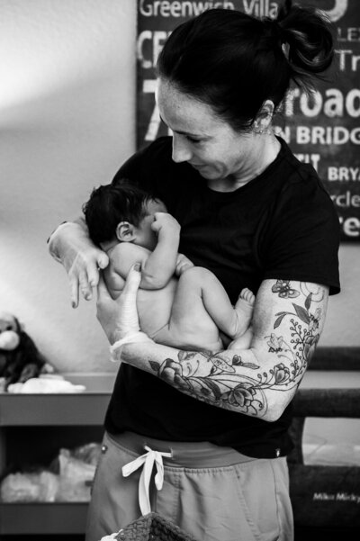 Joani Koenig checks mom and baby after homebirth