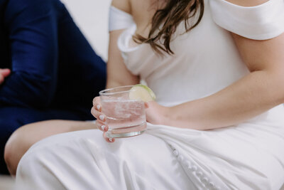 bride and groom smiling at each other and holding hands