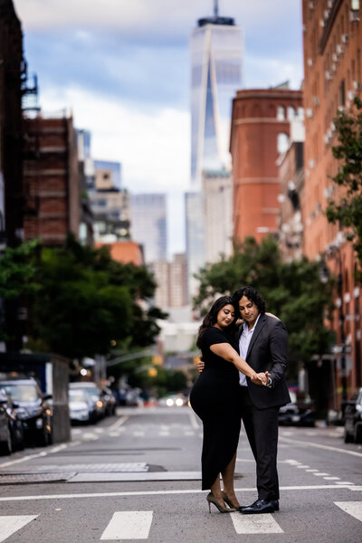 Explore the vibrant energy and romantic moments of Mary Grace and Martin's engagement shoot set against the bustling backdrop of New York City. This captivating image showcases the couple's love as they stroll through the iconic streets, with skyscrapers and city lights adding a dramatic flair to their tender moments. Ideal for couples seeking inspiration for their own engagement photos, this shoot exemplifies how New York City's dynamic urban landscape can serve as the perfect canvas for celebrating love.