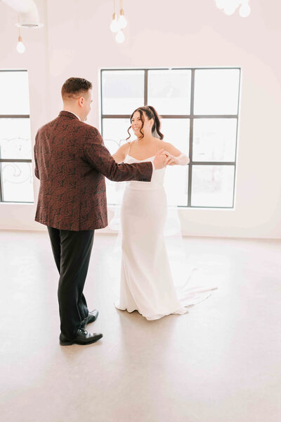 A bride and groom with their first look.