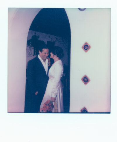 Polaroid photo of an interracial couple during their first look at their vow renewal at the Hacienda West in San Diego CA