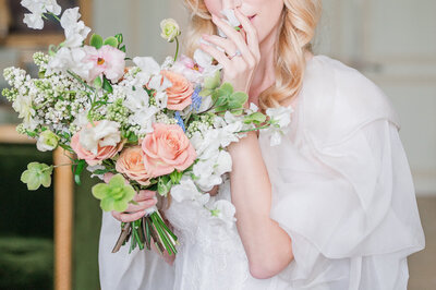 Bride smelling her bouquet
