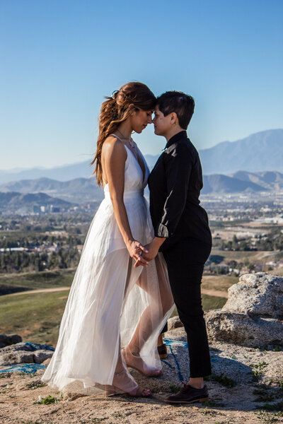 lesbian couple embrace in phoenix arizona wedding