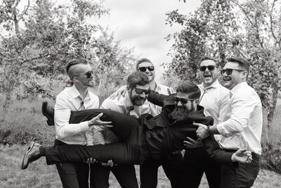 Wedding couple exiting the church in Port Gamble as guests toss flower petals in the air.