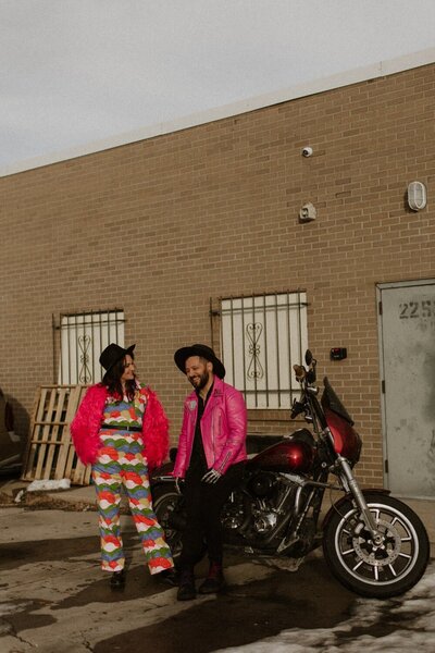 Downtown Denver Engagement session with hot pink outfits and a motorcycle