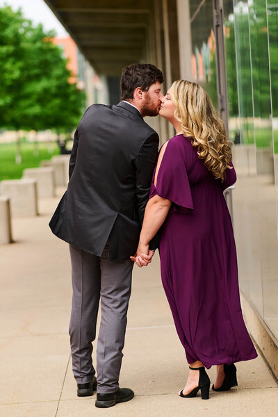 couple kissing in Millworks Dubuque