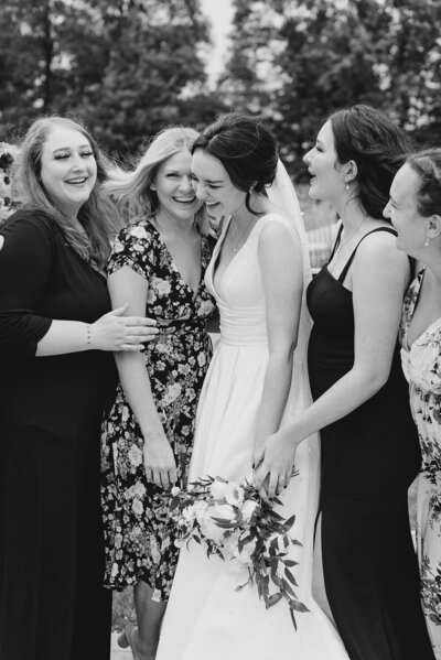 Bride smiling with her bridesmaids during portraits at Columbus, Ohio wedding
