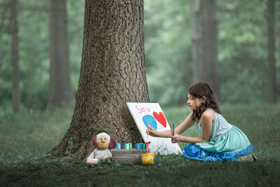artistic photos of child painting at  Veterans Park in Hamilton, New Jersey.