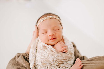 Baby smiling as she sleeps captured by Springfield MO family Photographer Jessica Kennedy of The XO Photography