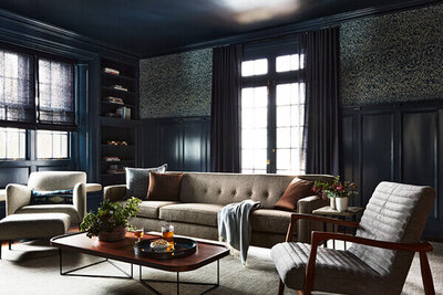 Historic home design in Boston featuring a navy blue family room in an old Concord home with original architecture and mid-century modern furniture.