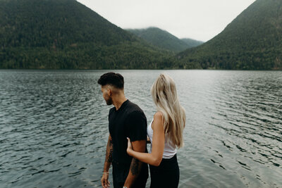 Couple holding hands and walking along the beach