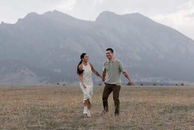 Couple walking in backyard during wedding portraits